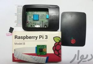 فروش raspberry pi 3 model B UK + دوربین 5 مگا پیکسیل خود رزبری پای + یک عدد رم 16GB + کیس مشکی خود رزبری پای + هیت سینگ های الومینومی ابی رنگ هم وصل شده